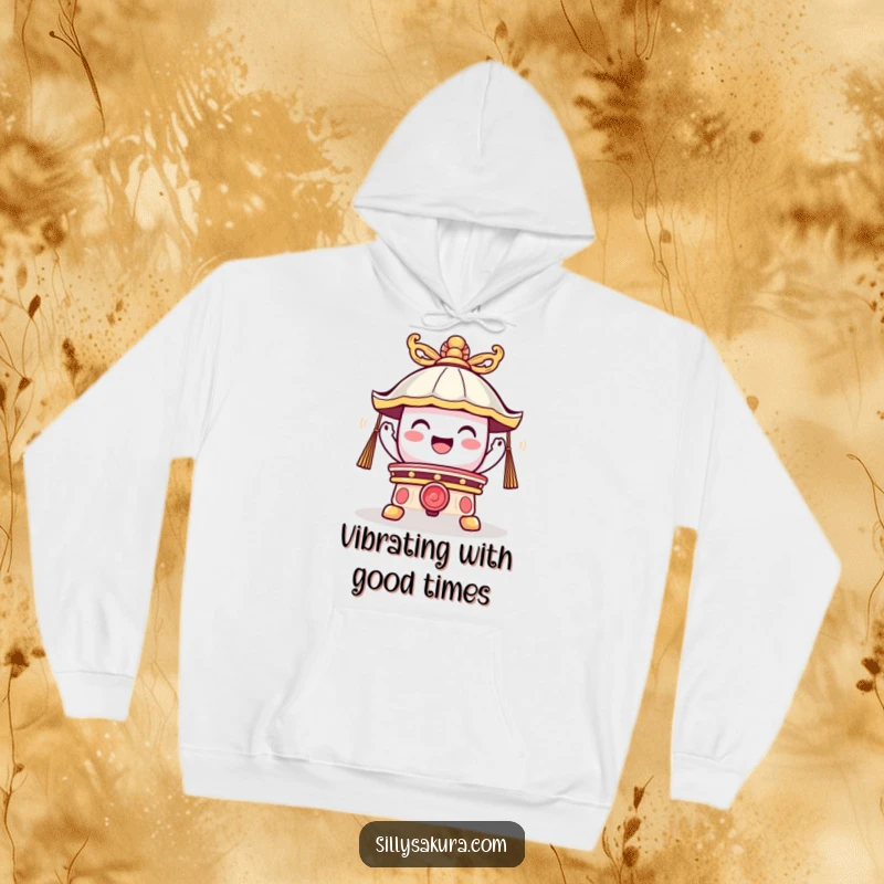 Funny hoodie with a cute temple bell character emitting a joyful vibration, offering warmth and humorous, uplifting vibes.