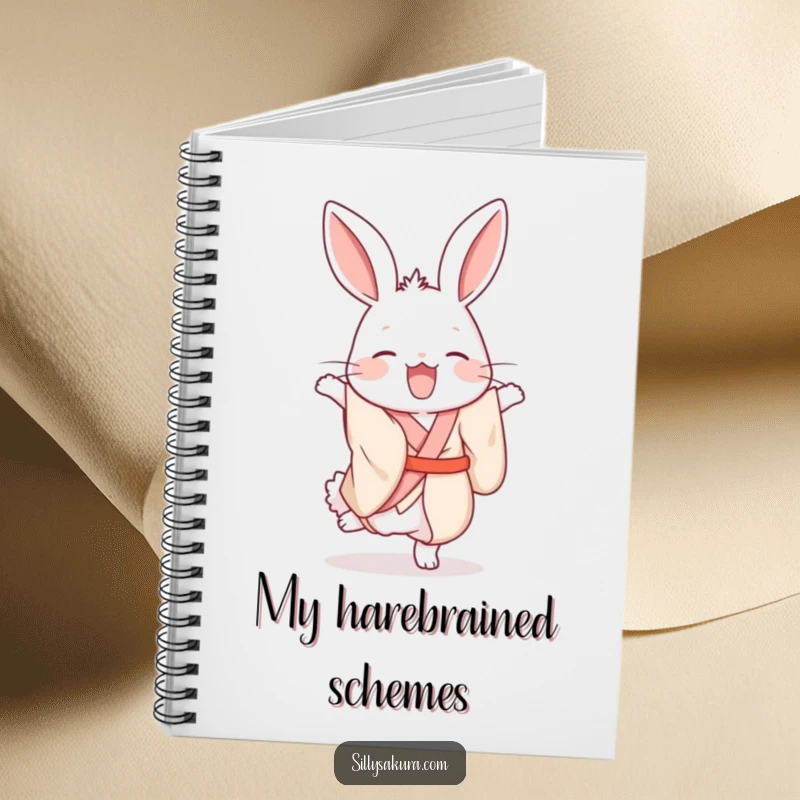 Funny giggling rabbit in a silk kimono humorously attempting a handstand on the cover of this notebook.