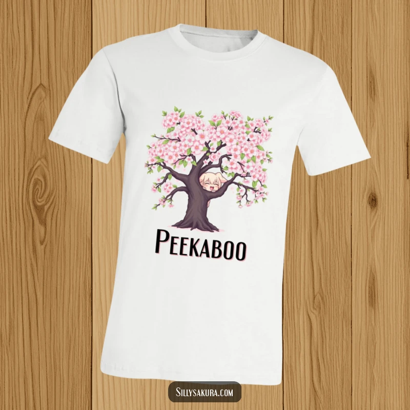 Funny Character T-Shirt: A mischievous character peeks from behind a blooming cherry blossom, embodying playful spring secrets.