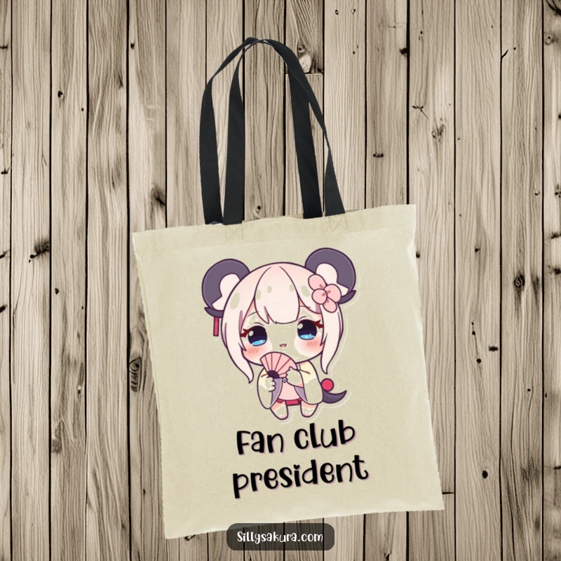 Funny tote bag featuring a shy character with a delicate blush, presenting a small fan, a charming accessory.